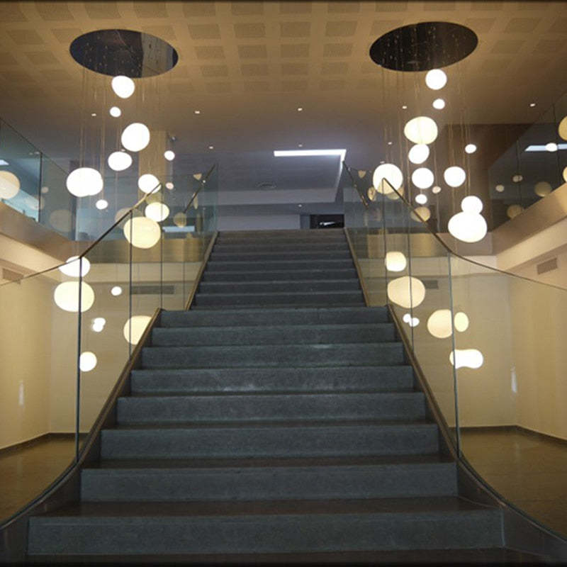 Luminária Pendente Elvora: Vidro Elegante em Formato de Ovo Flutuante